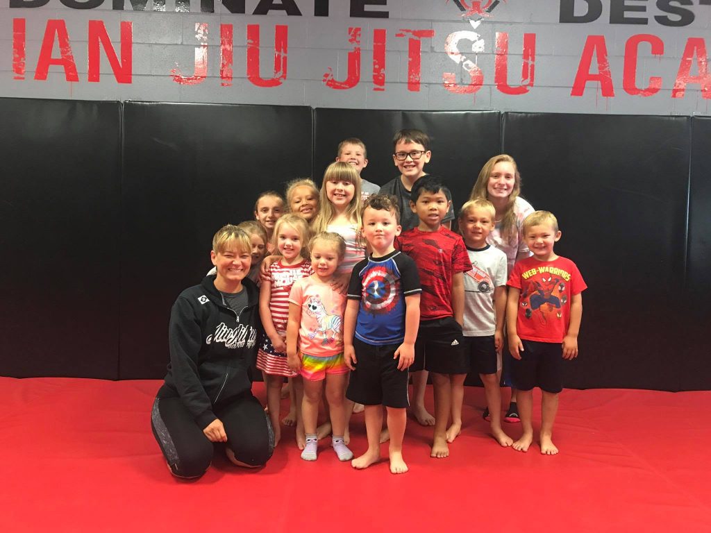 Purple Belt World Champion in Brazilian Jiu-Jitsu teaches kids class in Greenwood Indiana.